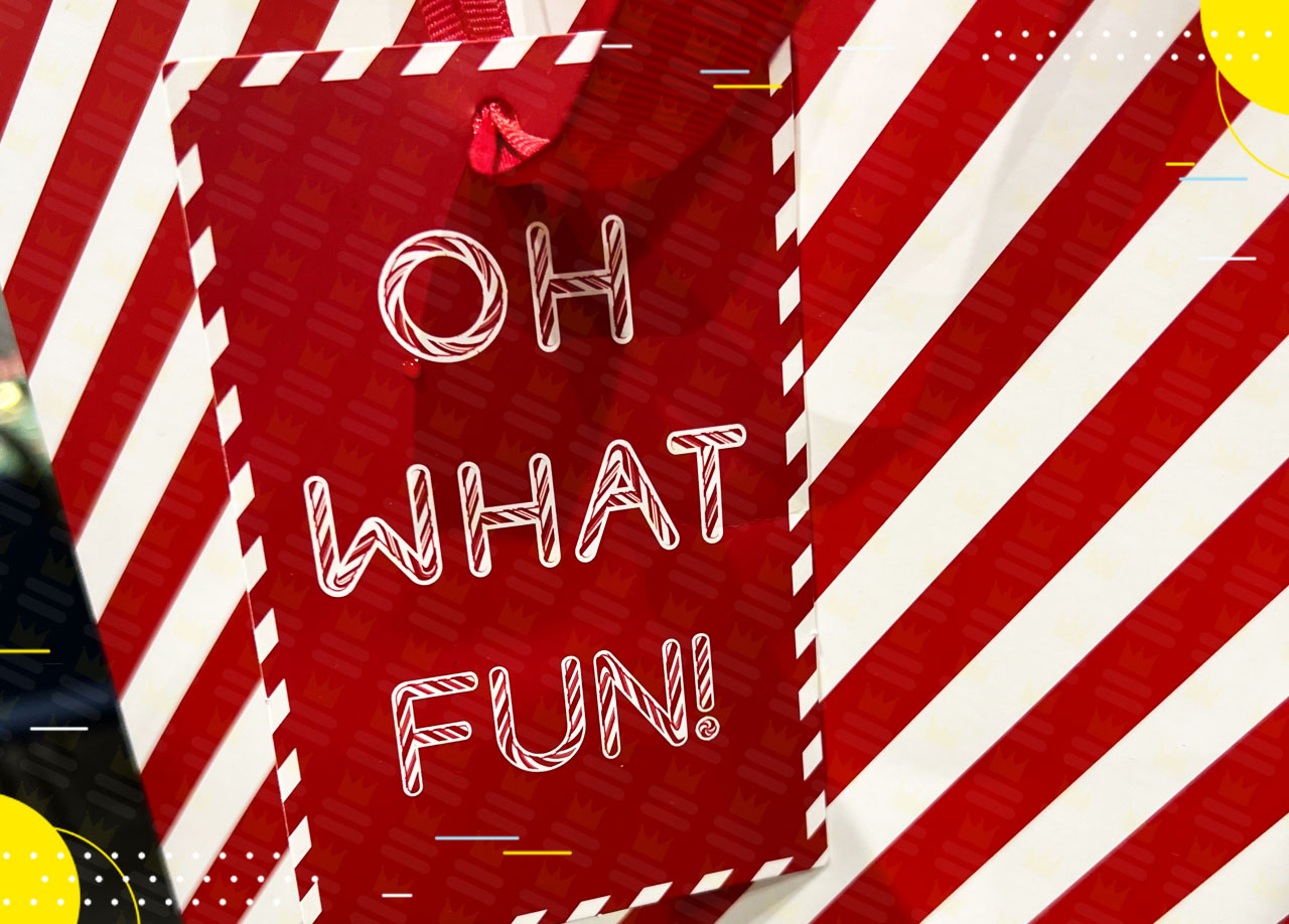 A red and white gift tag with the words oh what fun.