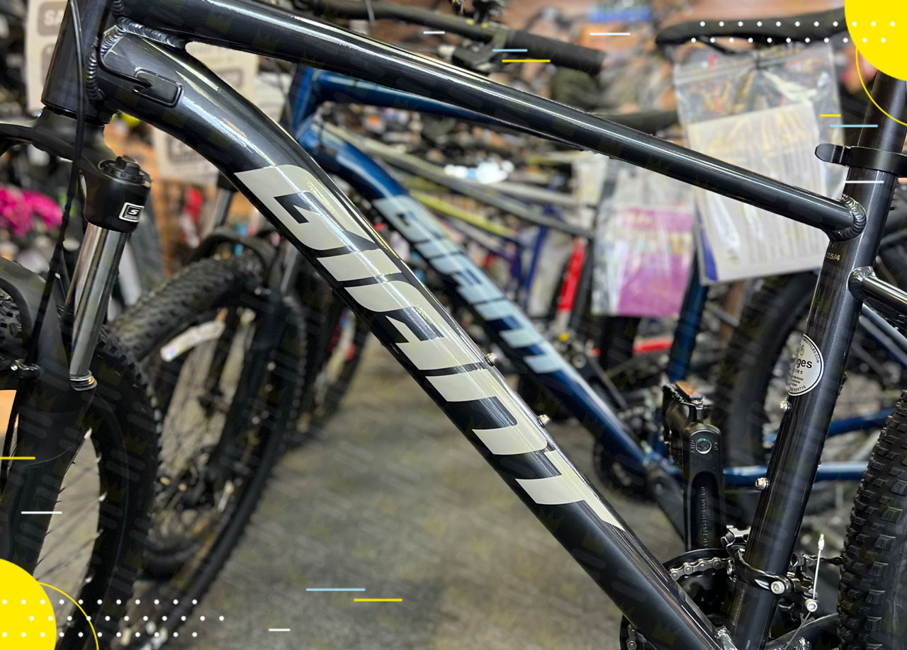 A new partnership between Fudges Cycles and a mountain bike is displayed in the store.