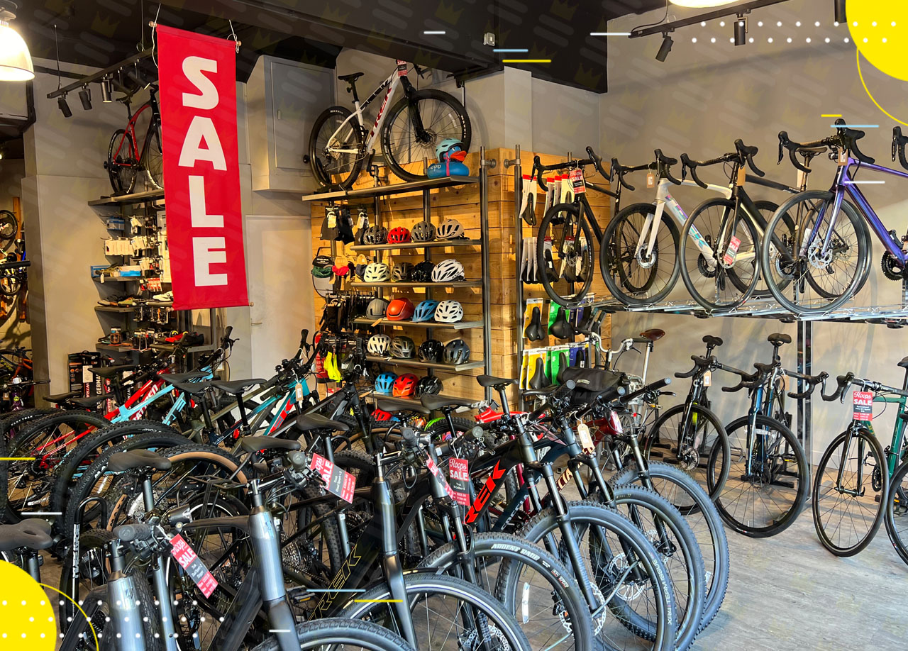A bicycle shop with many bikes for sale.